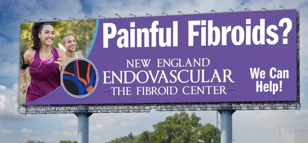 A billboard reads Painful Fibroids? New England Endovascular The Fibroid Center. We Can Help! with an image of two smiling women jogging, one in a purple tank top and the other in a pink tank top.