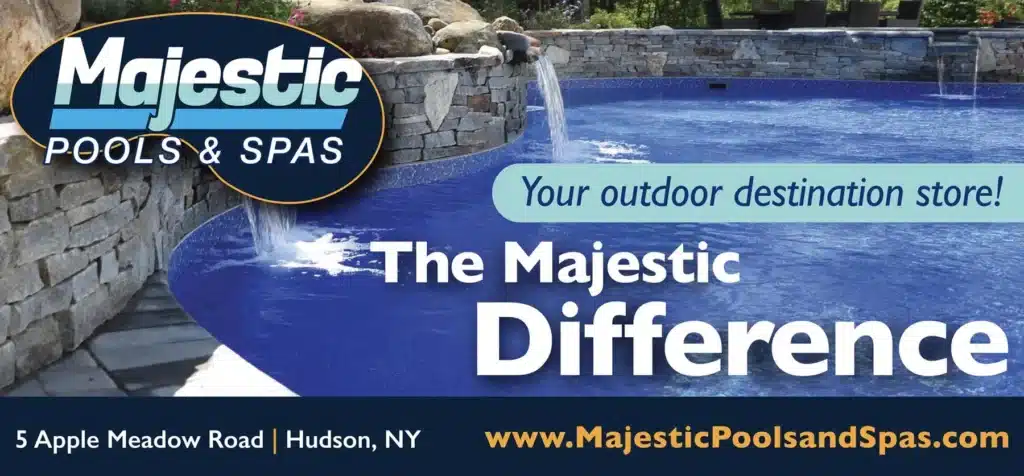 A luxurious outdoor pool with waterfalls, surrounded by stone walls and landscaping. Text reads: Majestic Pools & Spas. Your outdoor destination store! The Majestic Difference. Address and website are listed at the bottom.