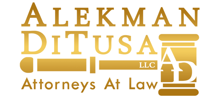 AlekmAn DiTusa LLC Attorneys At Law logo in gold text with a gavel and the initials AD inside a judge’s block.